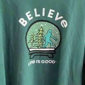 Life is Good Bigfoot BELIEVE Christmas Tee–Snow Globe Design, Green, Long Sleeve